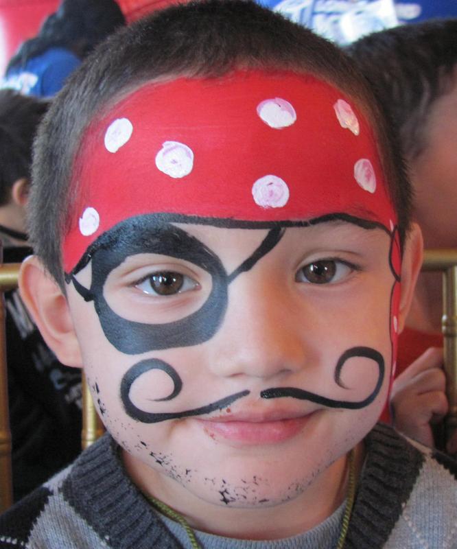 A boy with pirate-themed face paint