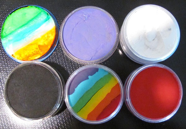 Containers of face paint in various colors